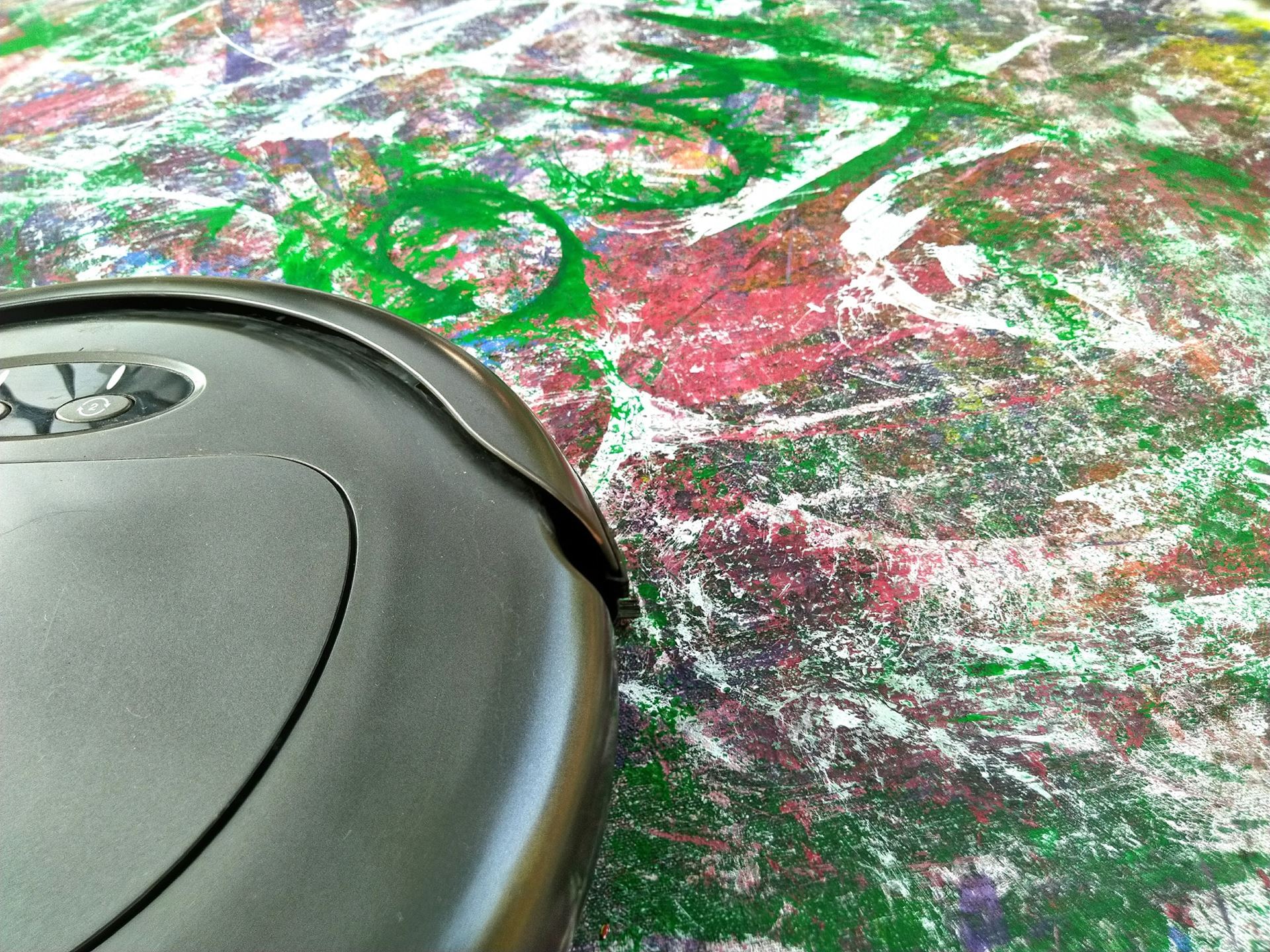 Closeup image of Matt Swift's Breaststrokes Columbus live audience particiaption action painting featruring a robot vacuum.