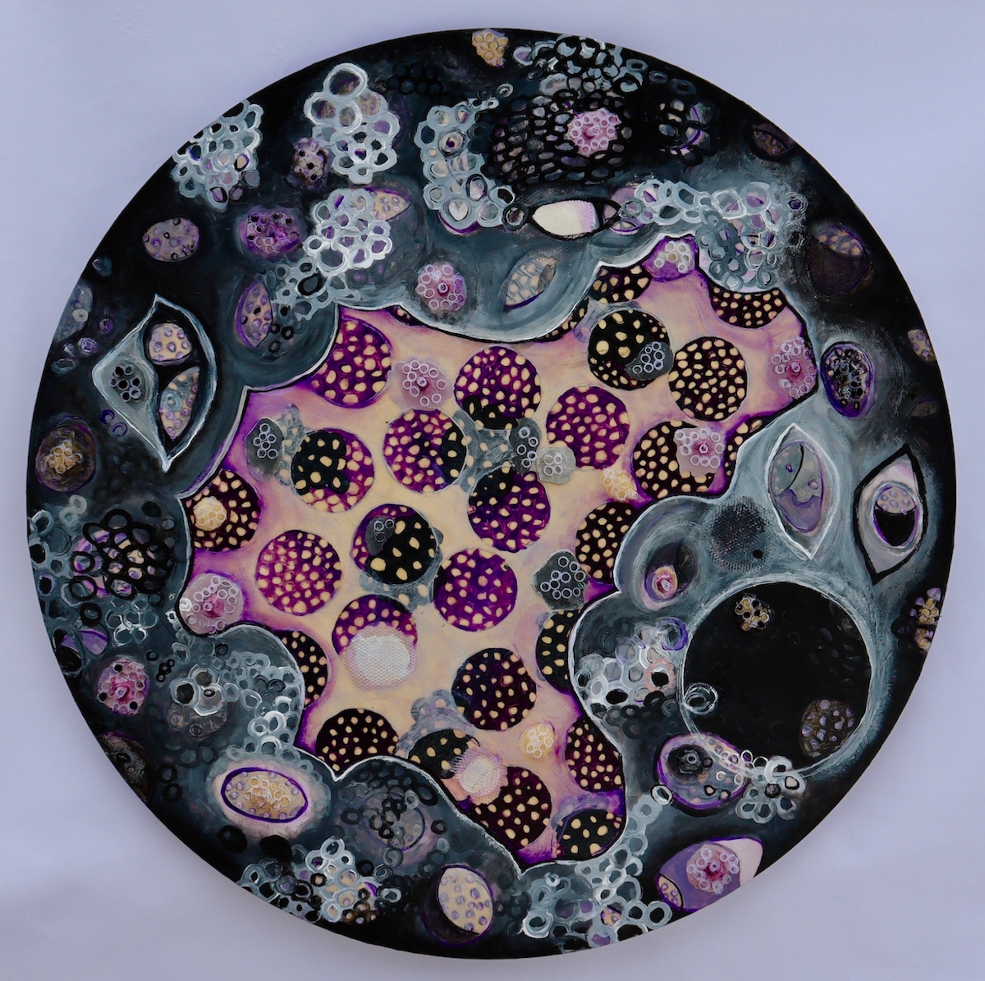 round paiting featuring circles and other shapes in blacks purples and yellows
